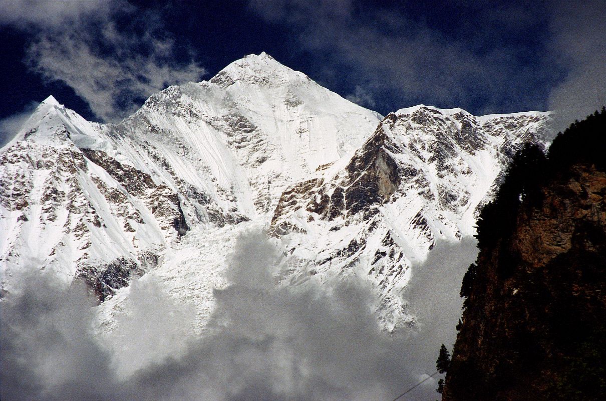 304 Dhaulagiri From Just Before Khobang �A little farther on we saw the upper slopes of Dhaulagiri, streaked with blue ice. The south-east ridge running down towards us, of which we had some hope, extended endlessly, as sharp as a blade of a knife and bristling with ice pinnacles and snow cornices - absolutely impregnable